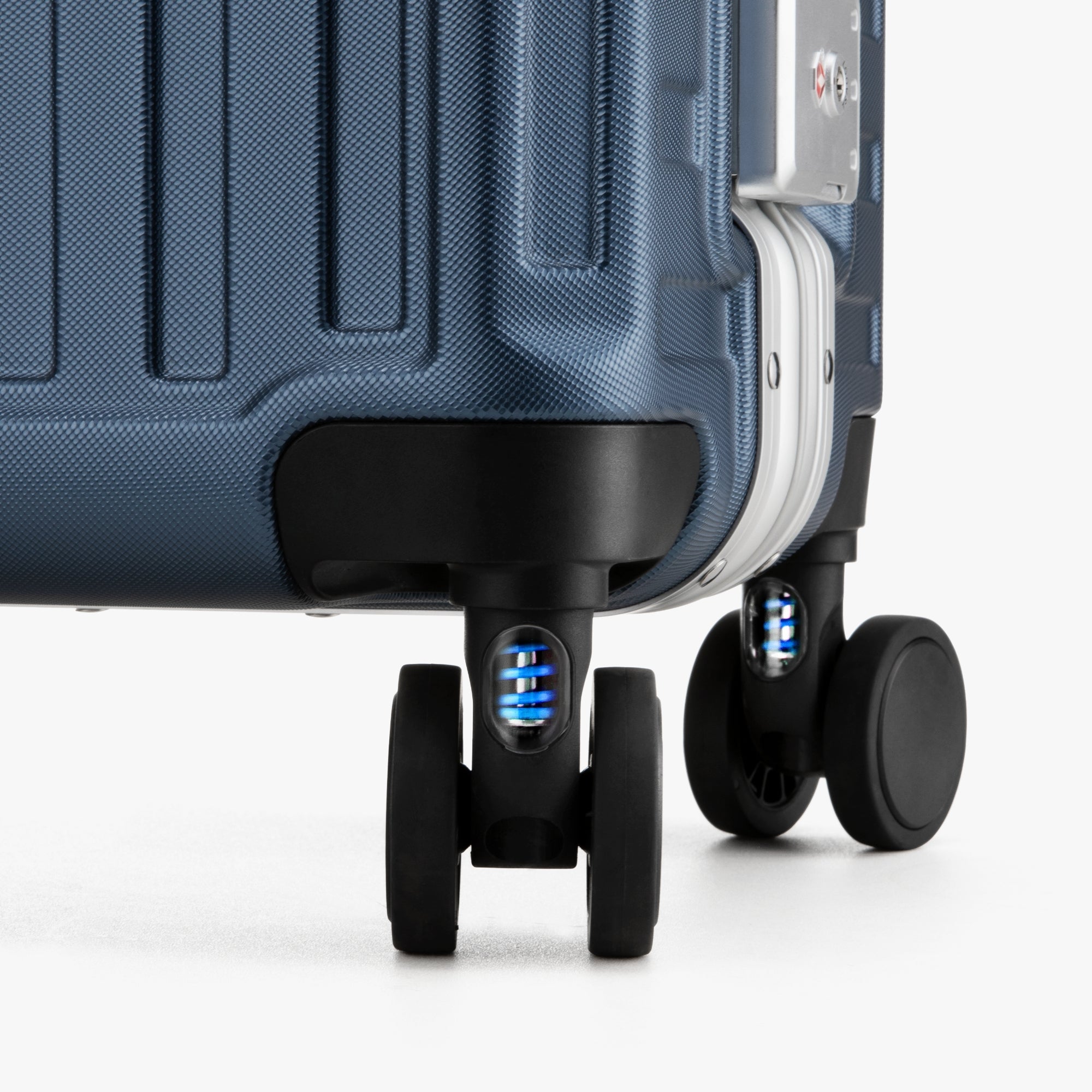 Close-up of LUGGEX 20-inch suitcase silent spinner wheels with shock-absorbing blue springs