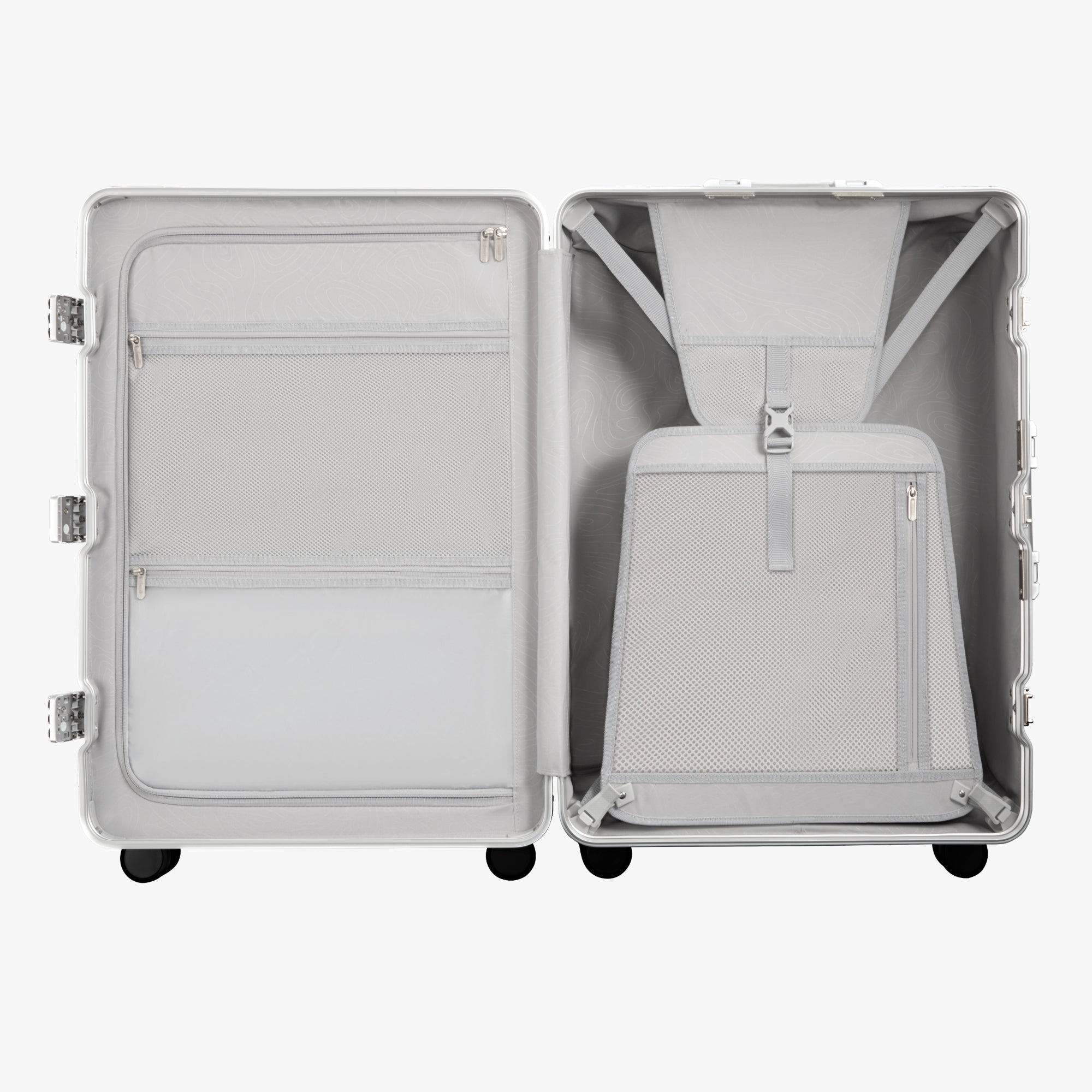 Open view of the LUGGEX 28-inch sliver grey aluminum-frame zipperless check-in suitcase showing upgraded interior with greater flexibility, smarter organization, and a waterproof pocket.