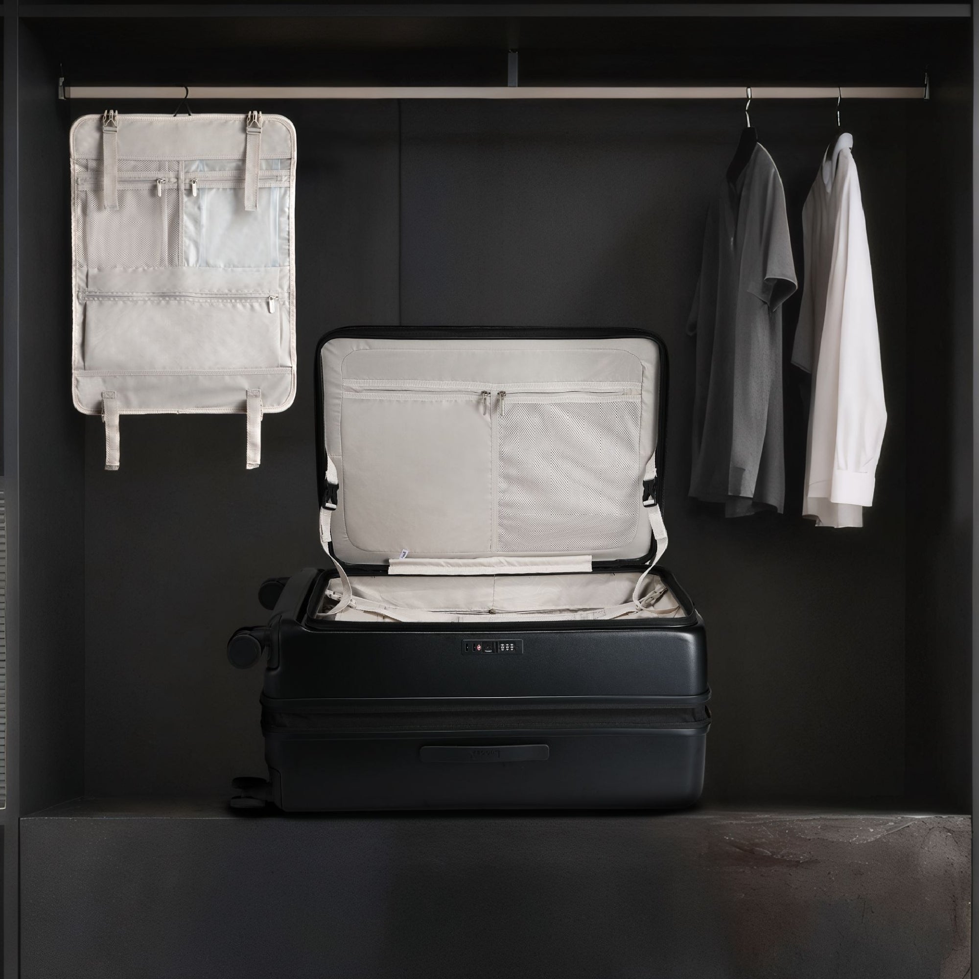 LUGGEX FLO5 28-inch top-open check-in luggage with removable hanging interior organizer. Space-saving design allows travelers to unpack easily in hotels or closets, ideal for efficient and organized packing. 
#color-charcoal-metallic