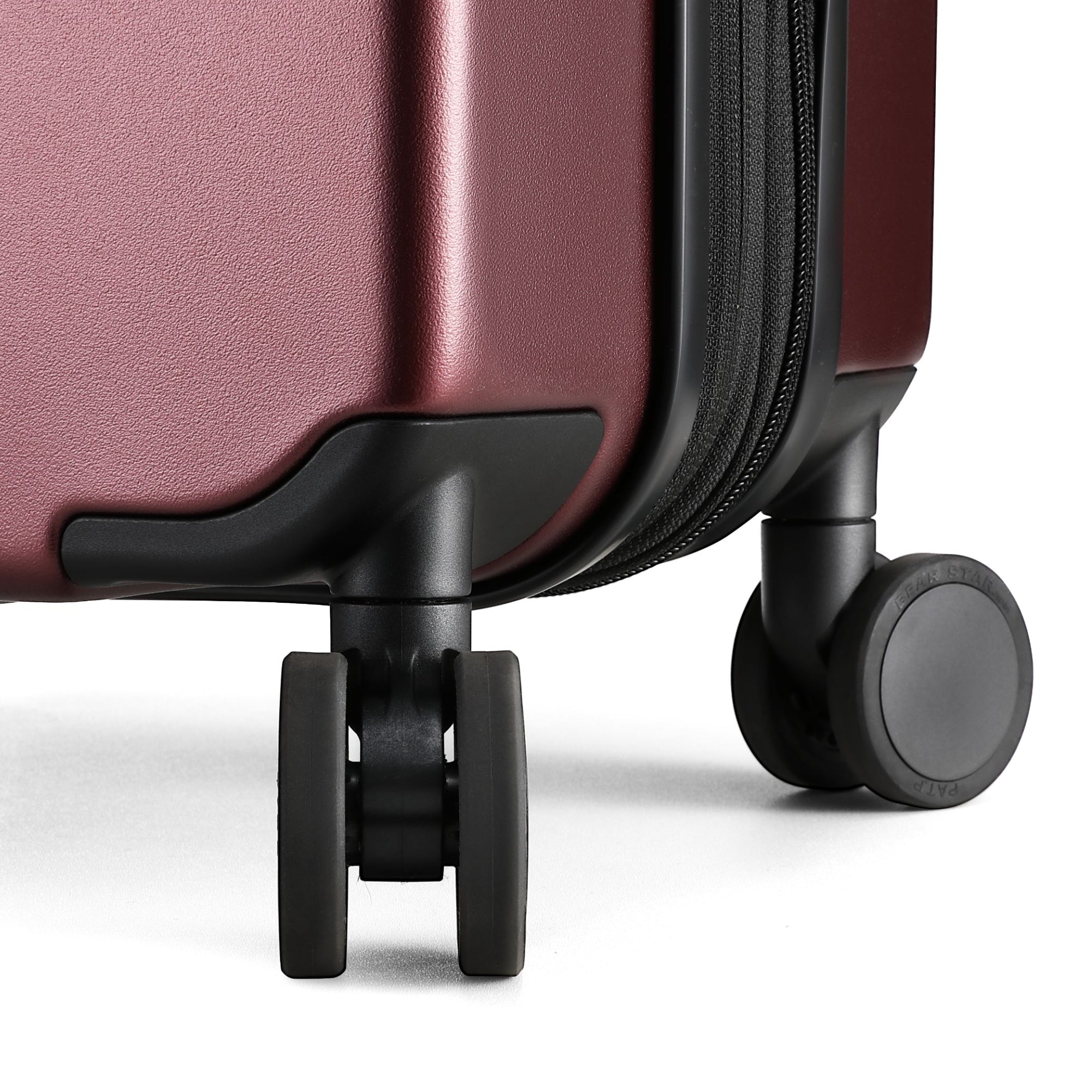 Close-up of 360-degree quiet spinner wheels on Luggex FLO 5 Core carry-on suitcase for smooth, silent travel.