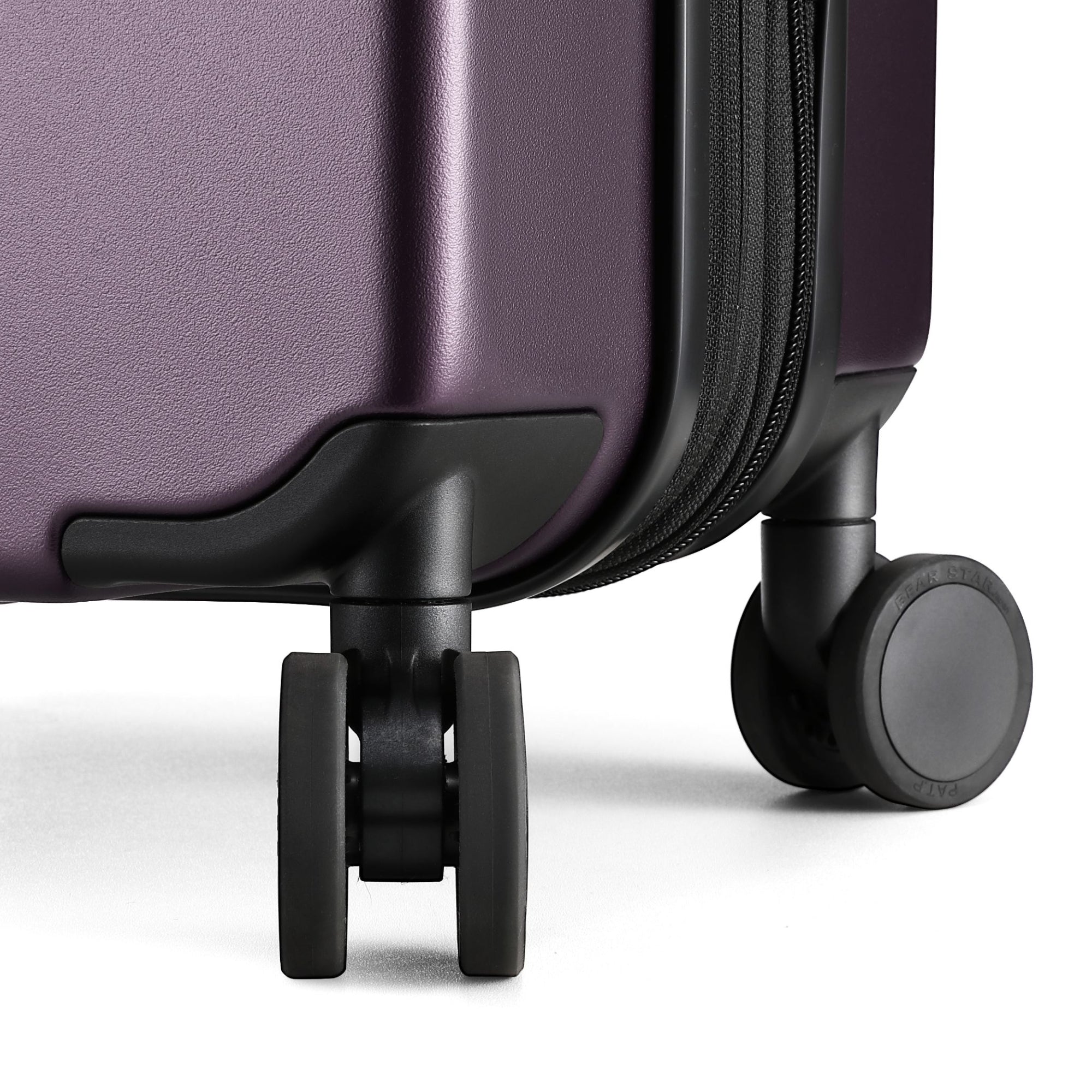 Close-up of 360-degree quiet spinner wheels on LUGGEX FLO 5 Core carry-on suitcase for smooth, silent travel.