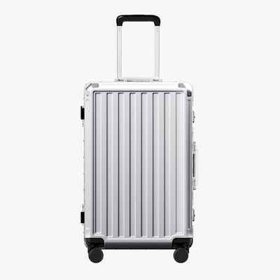 Side view of 24'' aluminum frame trunk luggage with a 4:6 trunk structure and protective foot pads that prevent scratches and wear when placed on the ground.  