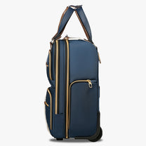 Side view of 16-inch underseat carry-on luggage with wheels, showing a slim profile, smooth-rolling wheels, and multiple zippered side pockets. #show #color_blue