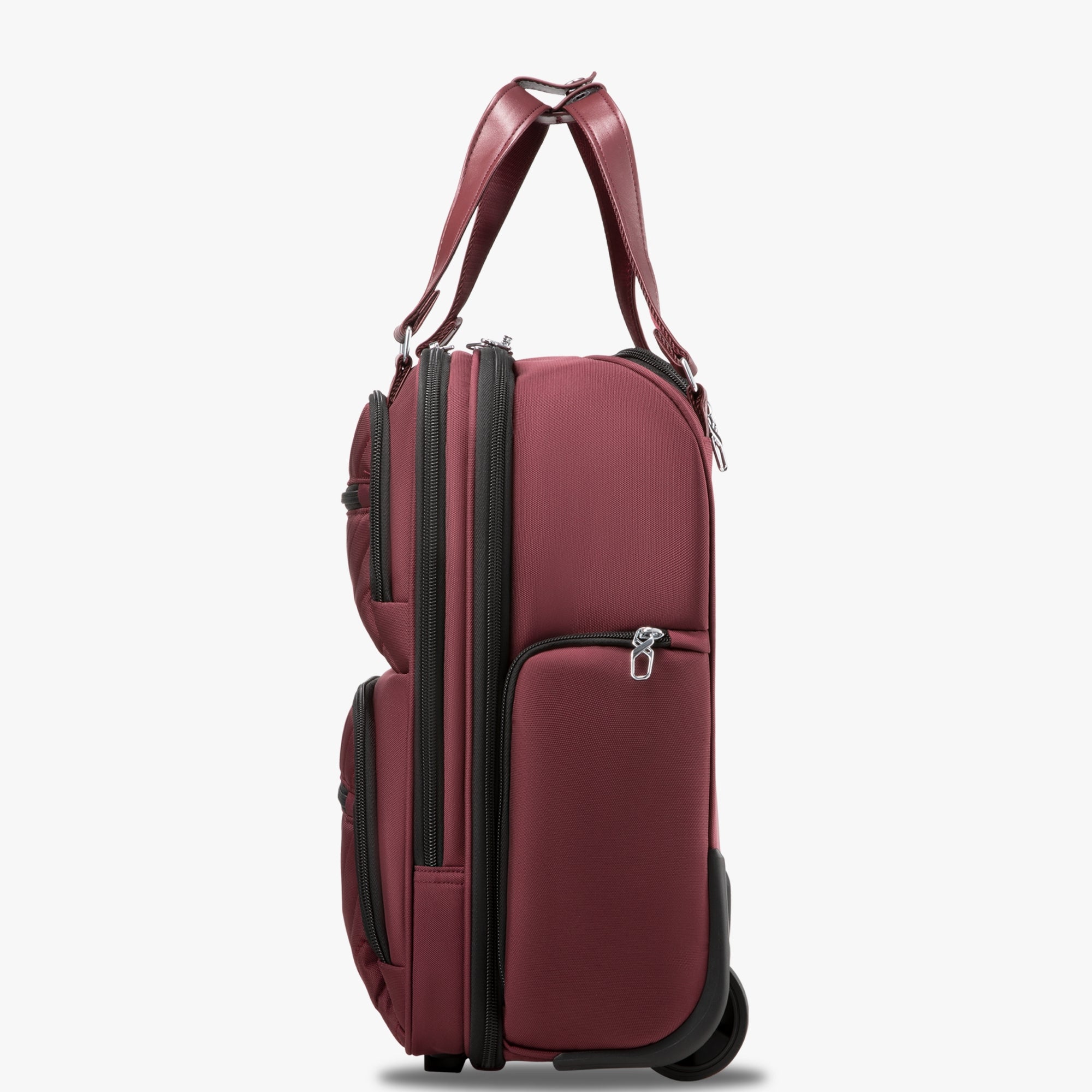 Side view of 16-inch underseat carry-on luggage with wheels, showing a slim profile, smooth-rolling wheels, and multiple zippered side pockets. #show #color_cherry_red