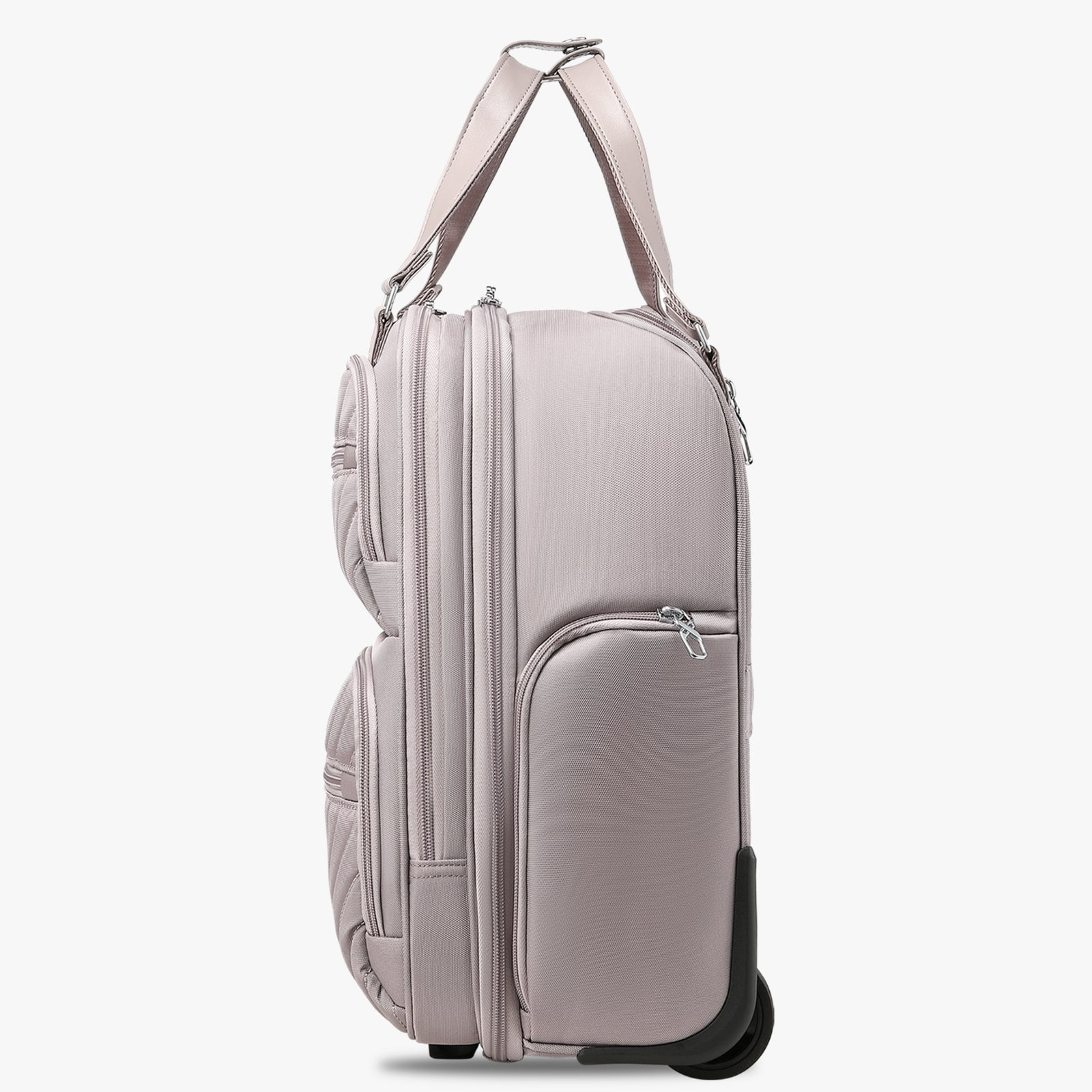 Side view of 16-inch underseat carry-on luggage with wheels, showing a slim profile, smooth-rolling wheels, and multiple zippered side pockets. #show #color_grey-pink
