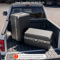 Two LUGGEX 32-inch black zipperless aluminum frame trunk luggage pieces loaded in a pickup truck bed, with a warning that 32-inch size may exceed some airline size limits.#color_charcoal #show