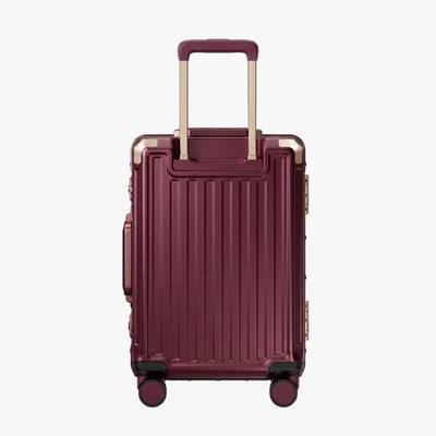 Side view of aluminum frame luggage with protective foot pads that elevate the shell and prevent scratches when the suitcase is placed on the ground. #show #color_cherry