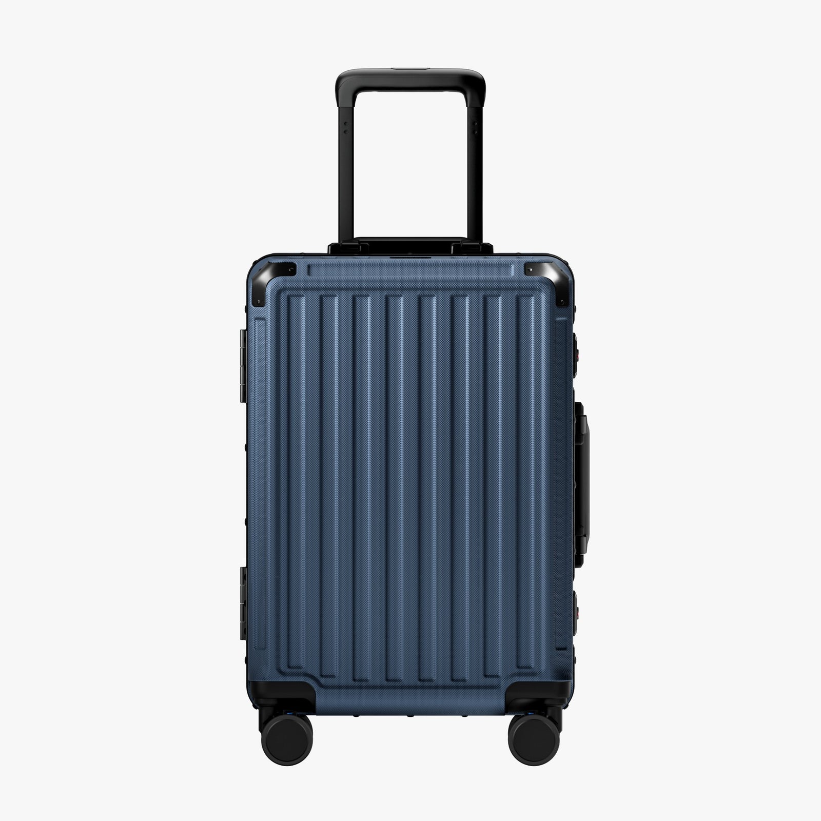 Side view of aluminum frame luggage with protective foot pads that elevate the shell and prevent scratches when the suitcase is placed on the ground. #show #color_navy_blue