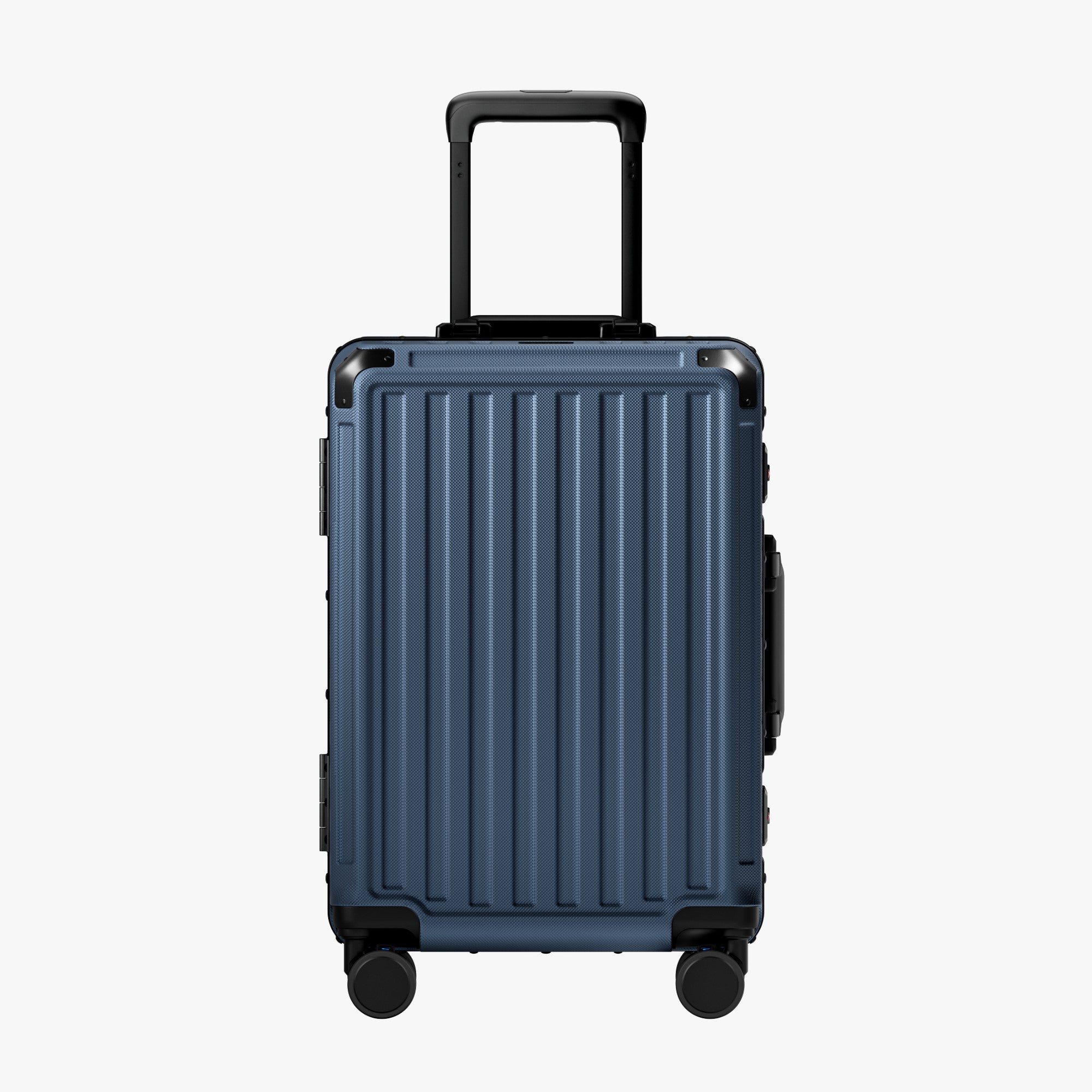 Side view of aluminum frame luggage with protective foot pads that elevate the shell and prevent scratches when the suitcase is placed on the ground. #show #color_navy_blue