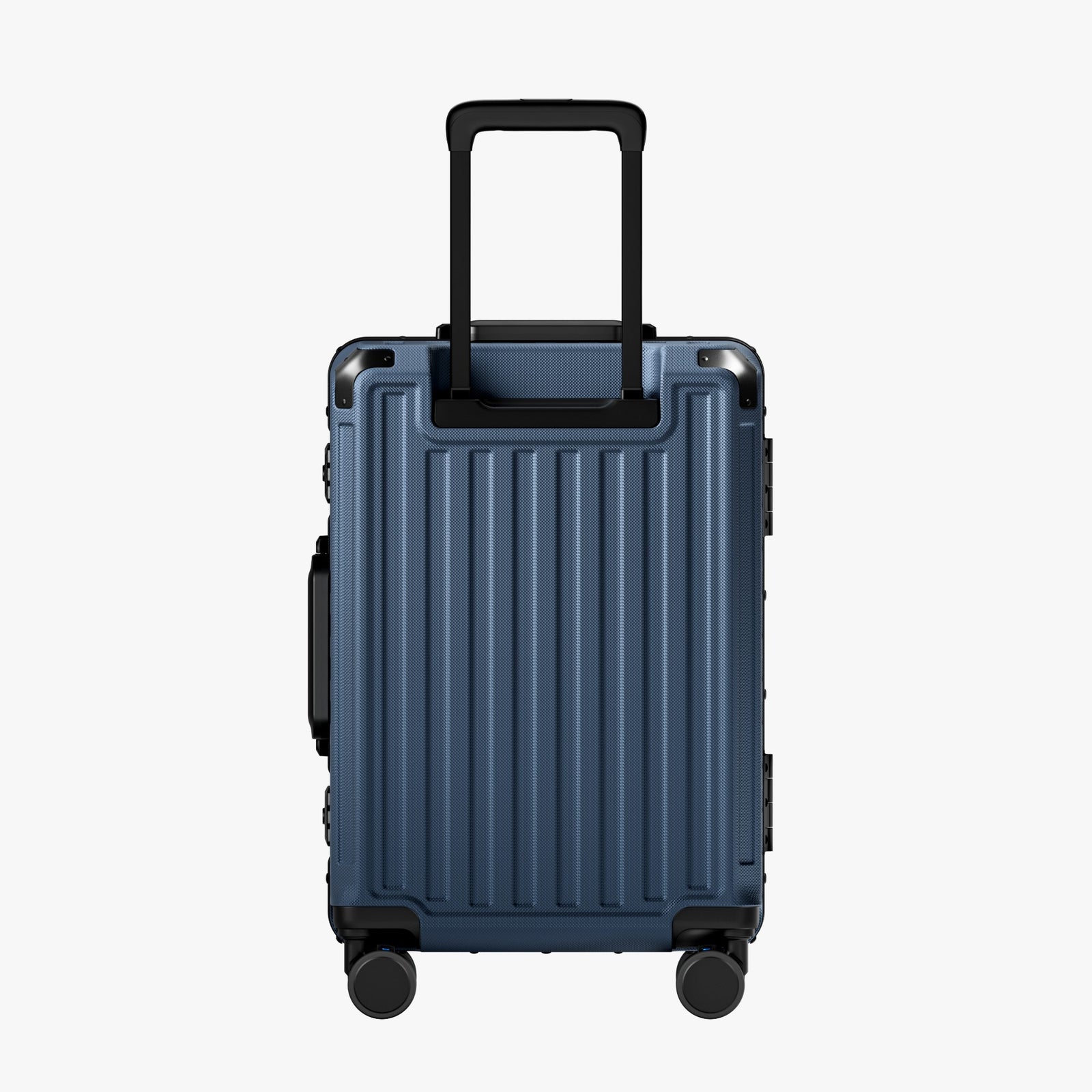 Side view of aluminum frame luggage with protective foot pads that elevate the shell and prevent scratches when the suitcase is placed on the ground. #show #color_navy_blue