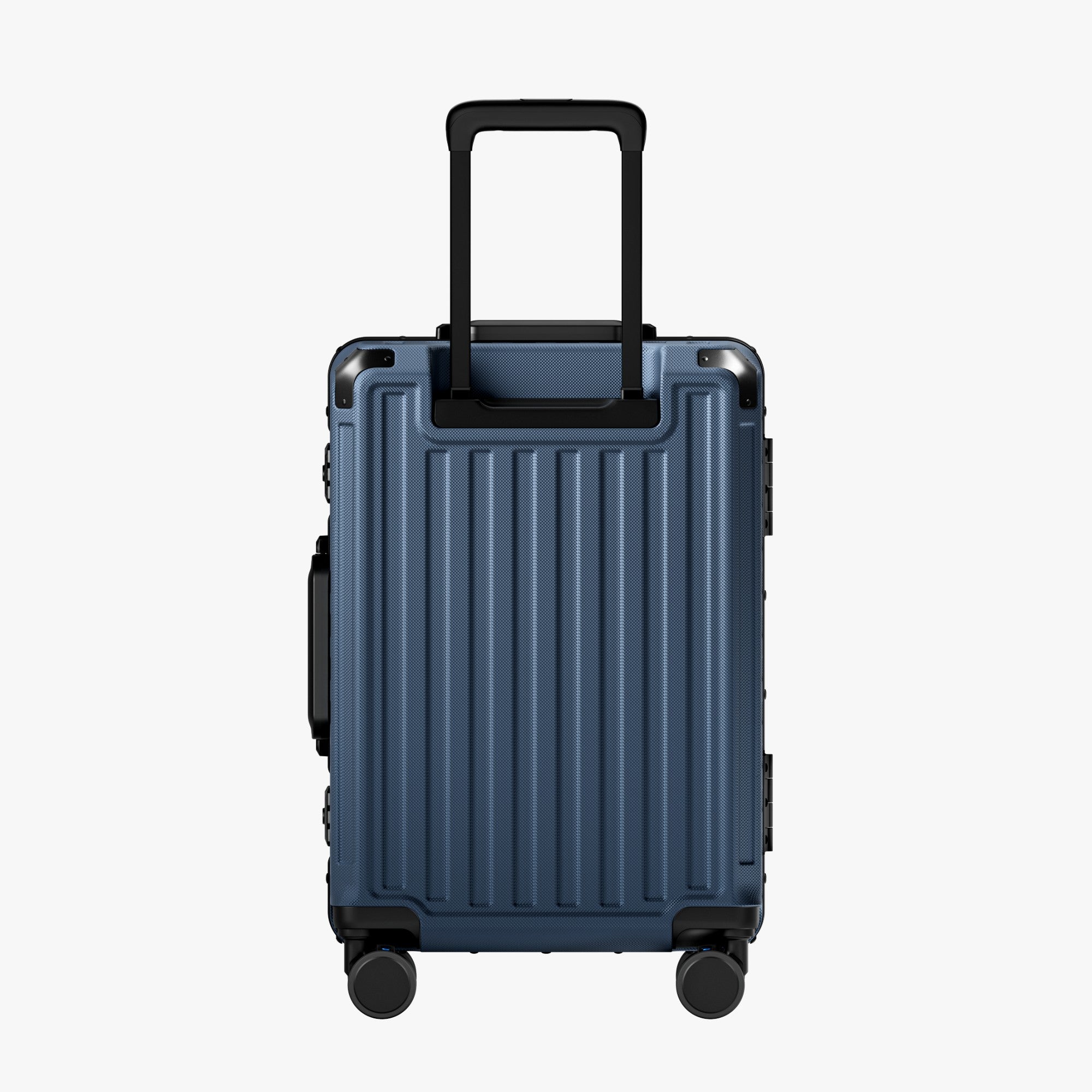 Side view of aluminum frame luggage with protective foot pads that elevate the shell and prevent scratches when the suitcase is placed on the ground. #show #color_navy_blue