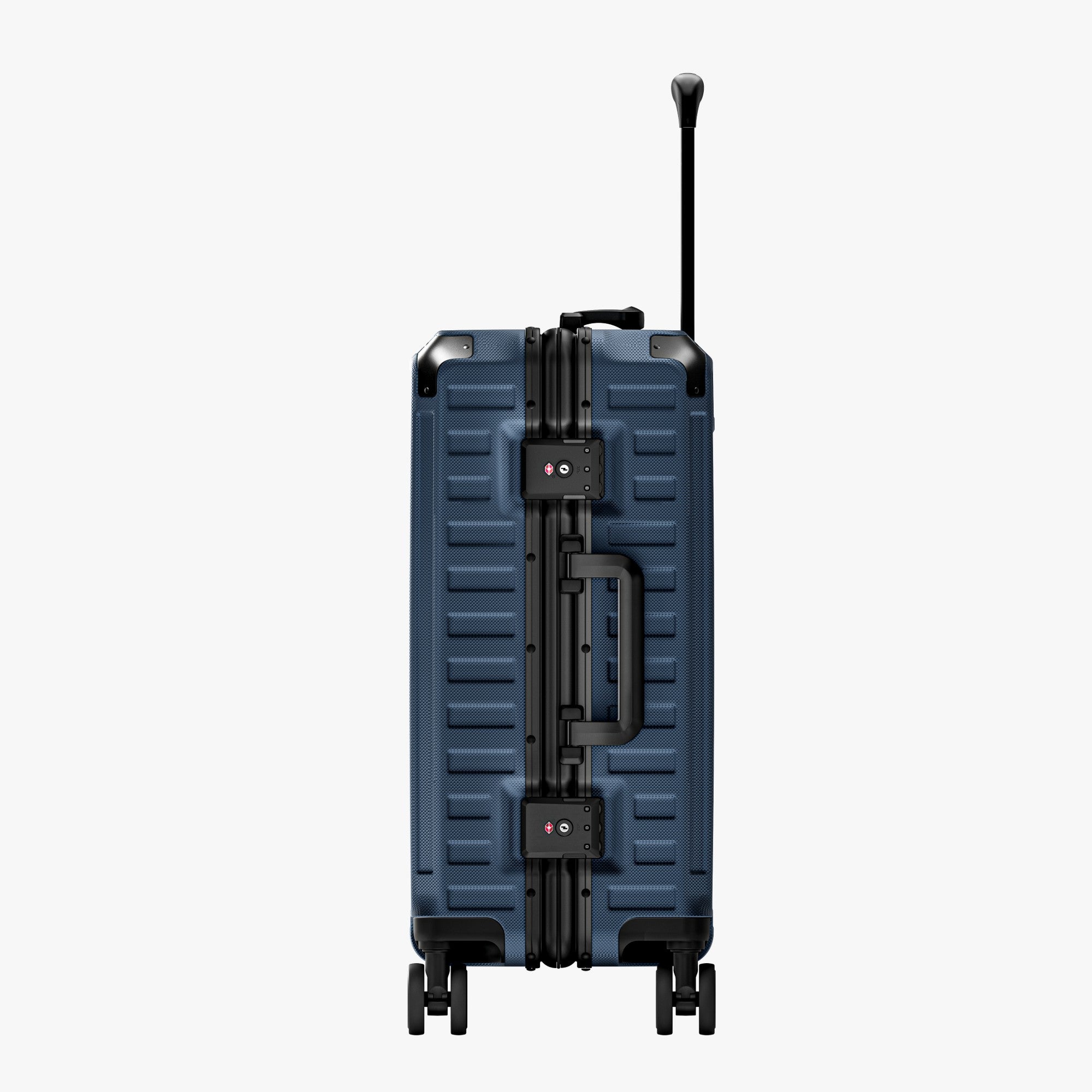 Side view of aluminum frame luggage with protective foot pads that elevate the shell and prevent scratches when the suitcase is placed on the ground. #show #color_navy_blue