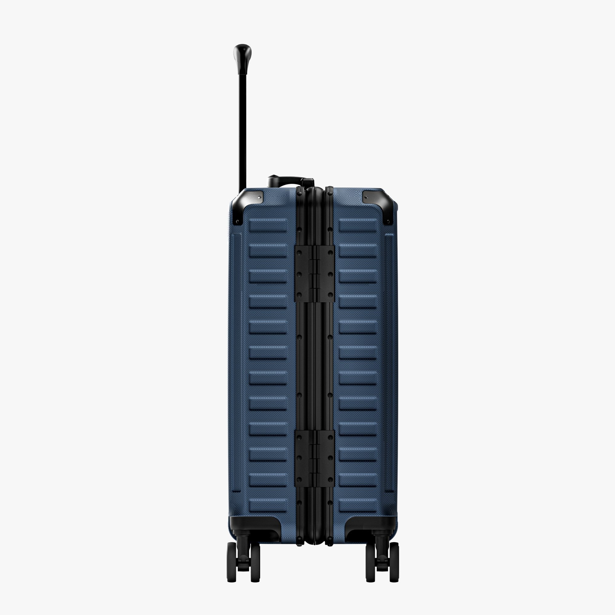Side view of aluminum frame luggage with protective foot pads that elevate the shell and prevent scratches when the suitcase is placed on the ground. #show #color_navy_blue