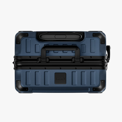 Side view of aluminum frame luggage with protective foot pads that elevate the shell and prevent scratches when the suitcase is placed on the ground. #show #color_navy_blue