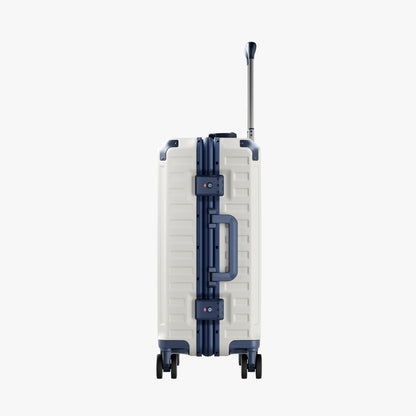 Side view of aluminum frame luggage with protective foot pads that elevate the shell and prevent scratches when the suitcase is placed on the ground. #show #color_white_blue
