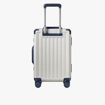 Side view of aluminum frame luggage with protective foot pads that elevate the shell and prevent scratches when the suitcase is placed on the ground. #show #color_white_blue
