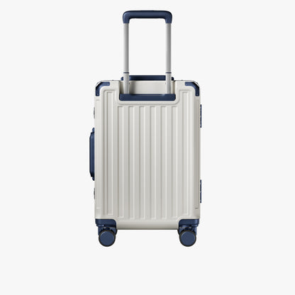 Side view of aluminum frame luggage with protective foot pads that elevate the shell and prevent scratches when the suitcase is placed on the ground. #show #color_white_blue