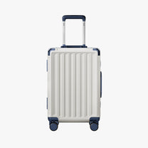 Side view of aluminum frame luggage with protective foot pads that elevate the shell and prevent scratches when the suitcase is placed on the ground. #show #color_white_blue