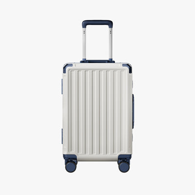 Side view of aluminum frame luggage with protective foot pads that elevate the shell and prevent scratches when the suitcase is placed on the ground. #show #color_white_blue