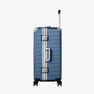 Back view of an aluminum frame check-in  suitcase with spinner wheels and a telescopic handle, designed for durable and smooth travel. 