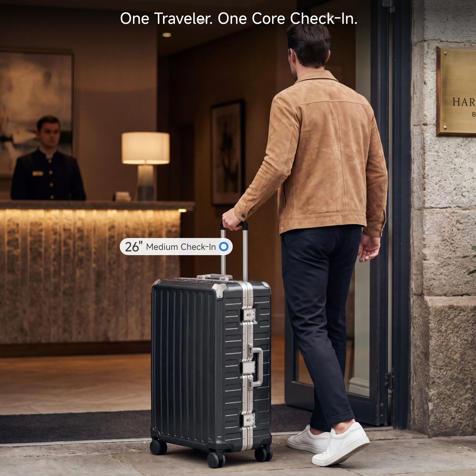 Man pulling a LUGGEX 26-inch black aluminum frame check-in luggage toward a luxury hotel entrance with a doorman in the background#color_charcoal #show