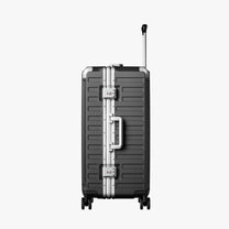 Front view of a check-in suitcase with a 100% polycarbonate shell, designed for lightweight durability and impact resistance. 