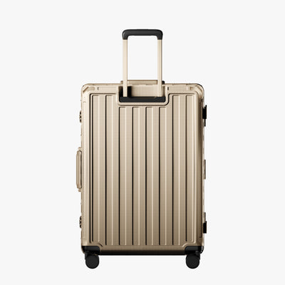 LUGGEX carry-on luggage in silver with silver aluminum frame — front, back, and side views showing zipperless hard shell, TSA lock, and spinner wheels. 