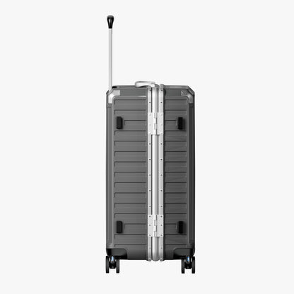 Side view of aluminum frame trunk luggage with a 4:6 trunk structure and protective foot pads that prevent scratches and wear when placed on the ground. 