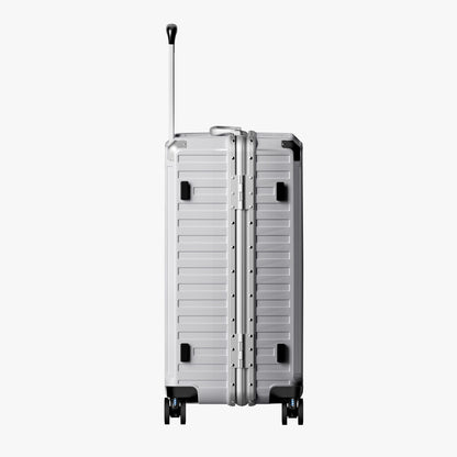 Side view of aluminum frame trunk luggage with a 4:6 trunk structure and protective foot pads that prevent scratches and wear when placed on the ground.  