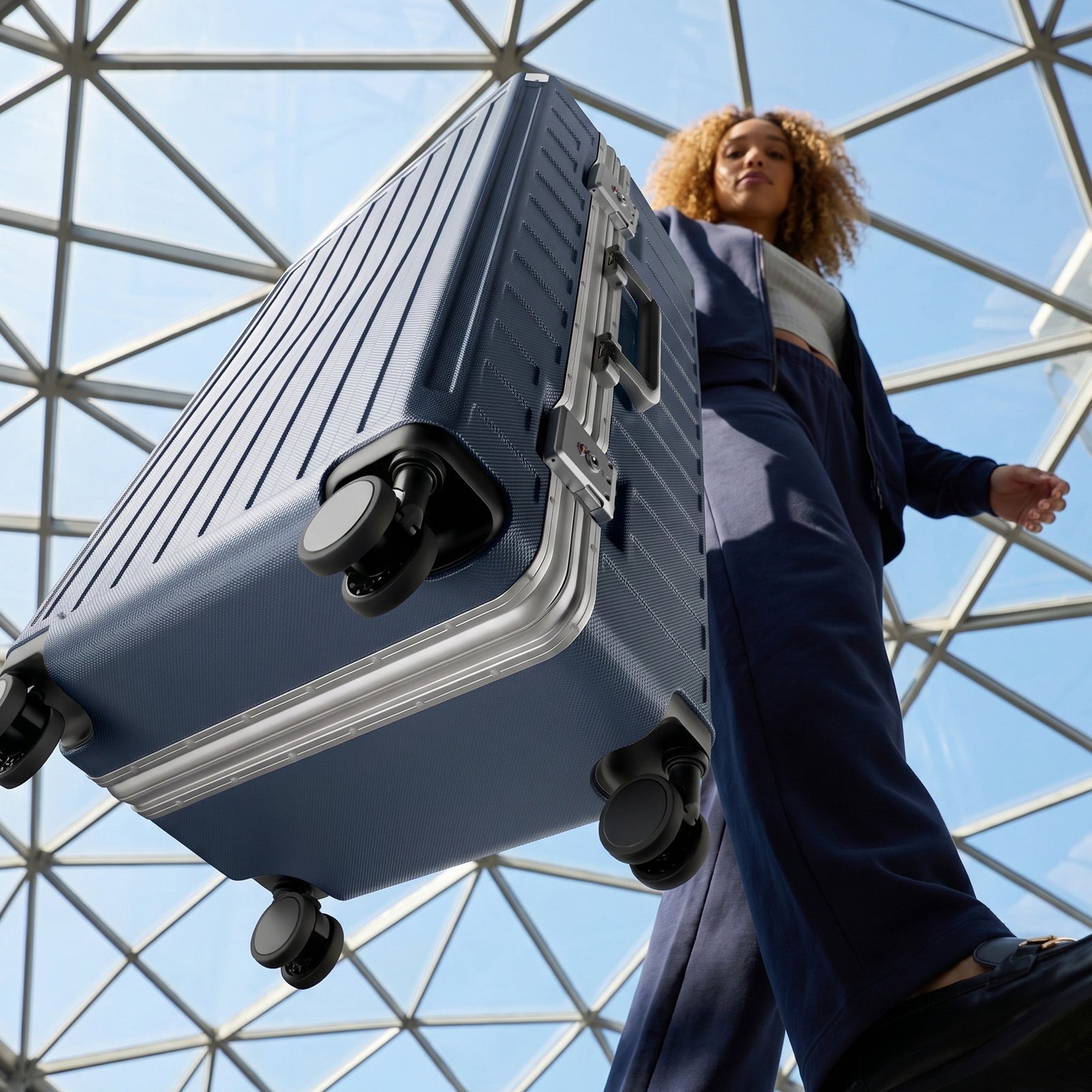LUGGEX Zipperless aluminum 24-inch check-in luggage with a 4-stage adjustable handle, reinforced corners, dual TSA-approved locks, shock-absorbing spinner wheels. 