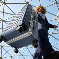 LUGGEX Zipperless aluminum 24-inch check-in luggage with a 4-stage adjustable handle, reinforced corners, dual TSA-approved locks, shock-absorbing spinner wheels. 