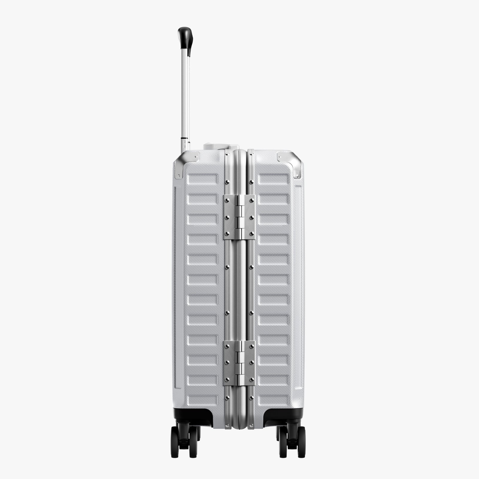 Side view of aluminum frame luggage with protective foot pads that elevate the shell and prevent scratches when the suitcase is placed on the ground. #show #color_sliver_grey