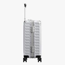 Side view of aluminum frame luggage with protective foot pads that elevate the shell and prevent scratches when the suitcase is placed on the ground. #show #color_sliver_grey