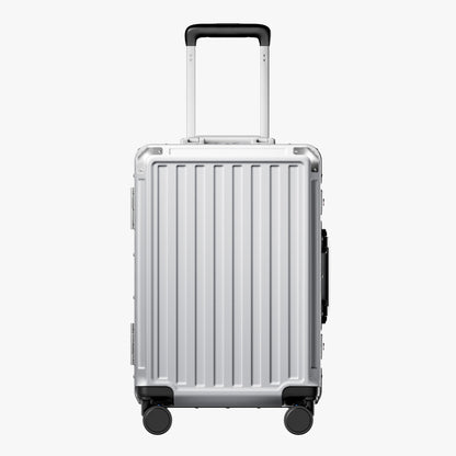 Side view of aluminum frame luggage with protective foot pads that elevate the shell and prevent scratches when the suitcase is placed on the ground. #show #color_sliver_grey
