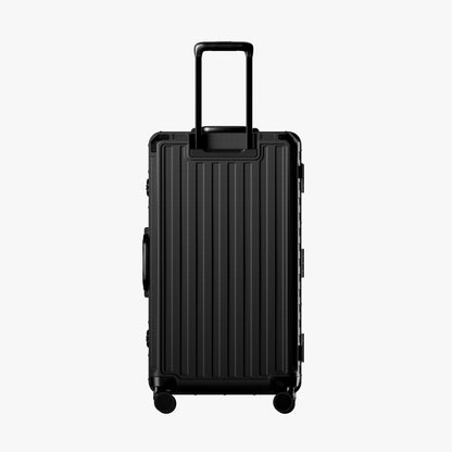 Reinforced Aluminum-Frame Shell
The reinforced shell and aluminum frame keep the suitcase upright, balanced, and stable—even when fully loaded.
Back view of LUGGEX 30-inch zipperless trunk-style suitcase.
#show