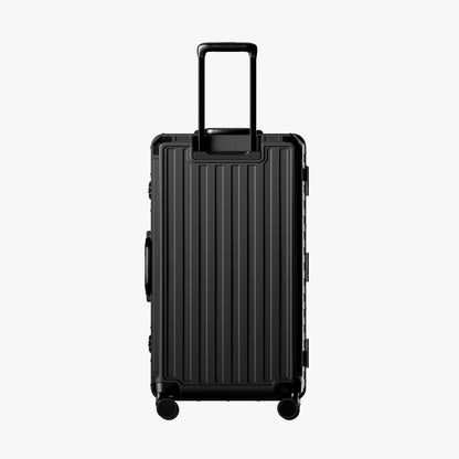 Reinforced aluminum-frame back shell designed to stay stable and balanced, even when fully packed. # Back view of LUGGEX 30-inch zipperless trunk-style suitcase with aluminum frame and reinforced shell #show
