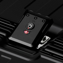 Integrated TSA locks secure the aluminum frame, allowing airport inspection without damage, while the embedded design helps prevent impact damage and accidental opening. #show #Close-up of LUGGEX TSA-approved combination lock on a zipperless aluminum frame suitcase