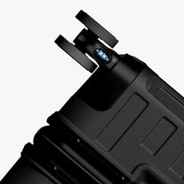 Engineered to absorb impact and roll smoothly under heavy loads across airports, sidewalks, and uneven surfaces. # Close-up of LUGGEX shock-absorbing 360-degree spinner wheels on a 30-inch trunk-style suitca #show