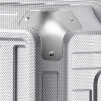 Side view of 24'' aluminum frame trunk luggage with a 4:6 trunk structure and protective foot pads that prevent scratches and wear when placed on the ground.  