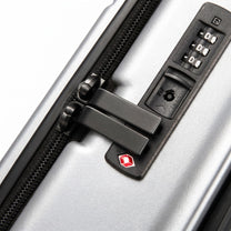LUGGEX FLA front open carry-on suitcase with reinforced side foot pads and rivet-free aluminum frame—designed to protect the shell when placed on its side.

