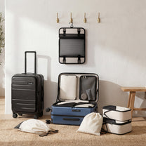 LUGGEX FLA front open carry-on suitcase with reinforced side foot pads and rivet-free aluminum frame—designed to protect the shell when placed on its side.

