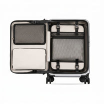 LUGGEX FLA front open carry-on suitcase with reinforced side foot pads and rivet-free aluminum frame—designed to protect the shell when placed on its side.

