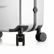 LUGGEX FLA front open carry-on suitcase with reinforced side foot pads and rivet-free aluminum frame—designed to protect the shell when placed on its side.

