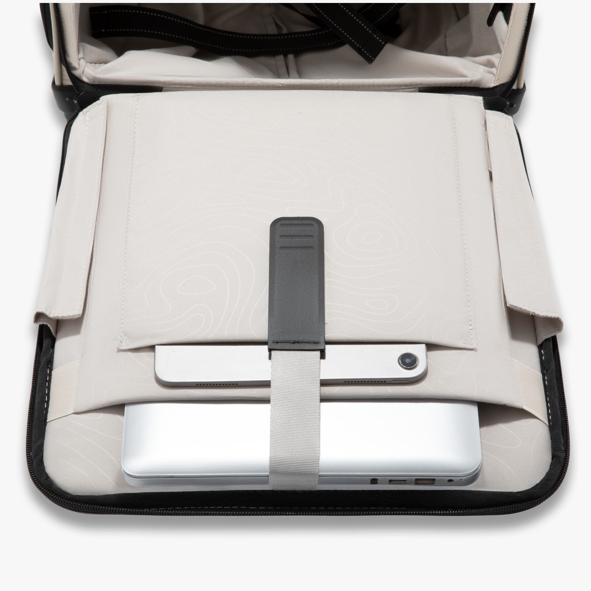 Laptop and tablet compartment inside LUGGEX 16-inch underseat carry-on, designed to securely fit up to a 14-inch laptop and iPad for organized and convenient travel.
