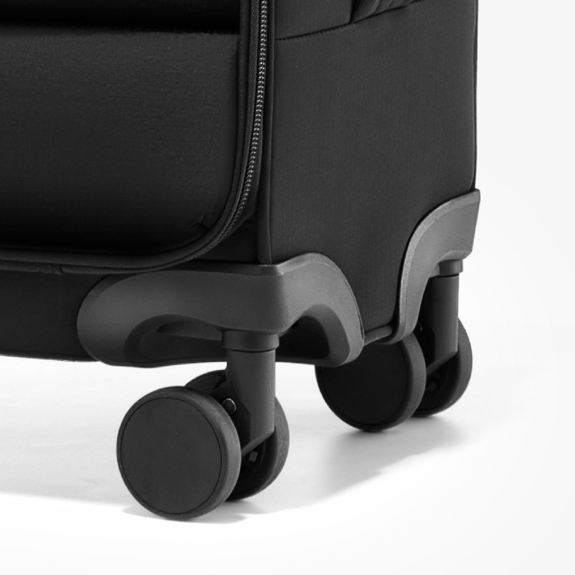 Close-up of LUGGEX 16-inch underseat carry-on luggage featuring 8 smooth and silent spinner wheels for stable and effortless rolling during travel.

