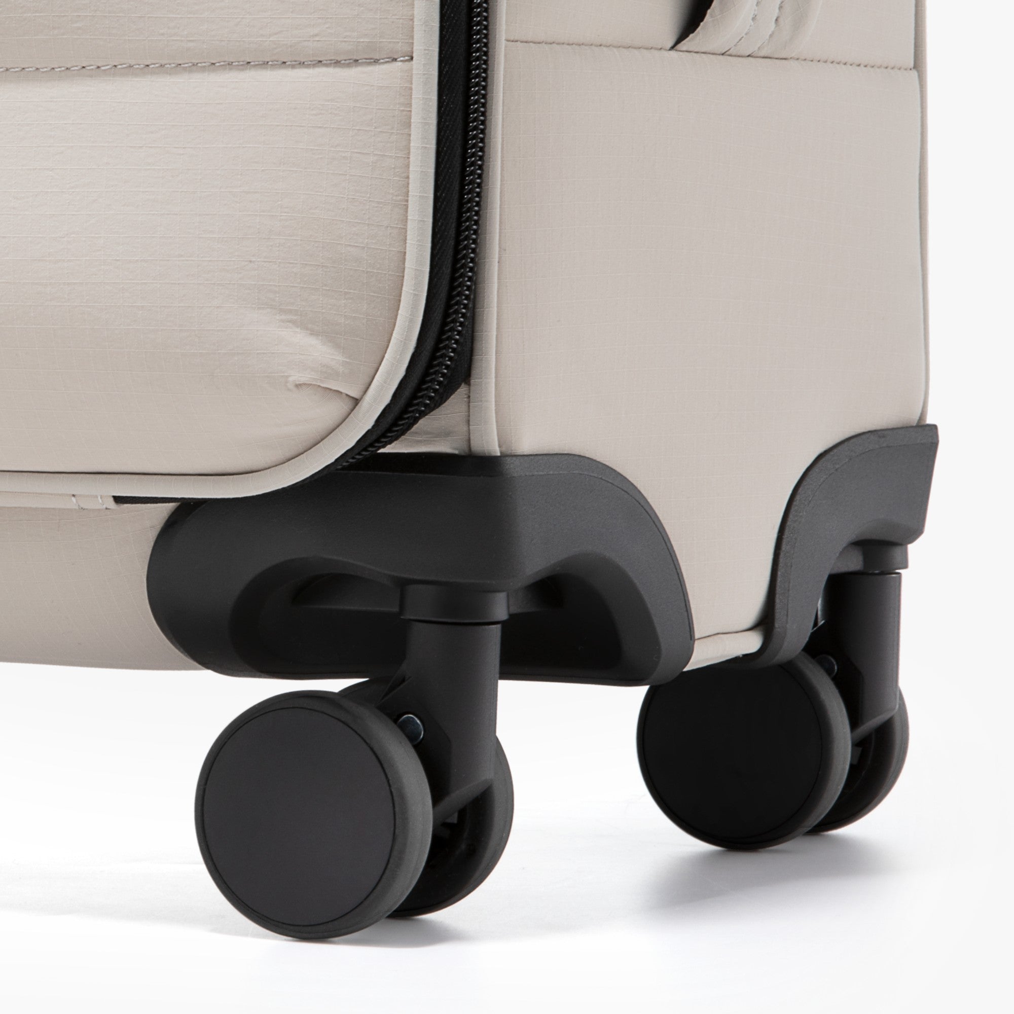 Close-up of LUGGEX 16-inch underseat carry-on luggage featuring 8 smooth and silent spinner wheels for stable and effortless rolling during travel.

