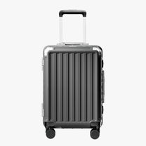 Front view of a carry-on suitcase with a 100% polycarbonate shell, designed for lightweight durability and impact resistance. 