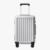 Front view of a carry-on suitcase with a 100% polycarbonate shell, designed for lightweight durability and impact resistance. 