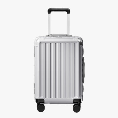 Front view of a carry-on suitcase with a 100% polycarbonate shell, designed for lightweight durability and impact resistance. 