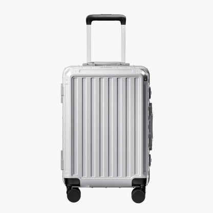 Front view of a carry-on suitcase with a 100% polycarbonate shell, designed for lightweight durability and impact resistance. #show #color_sliver_grey